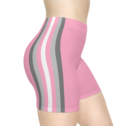 An individual is wearing the Demi-girl Pride Flag Bike Shorts, which are tight-fitting and high-waisted. The shorts are pink with vertical stripes in white, gray, and darker gray running down the side. The image centers on the lower torso and upper thigh area, showcasing the moisture-wicking fabric against a plain white background.