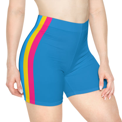 A person is shown from the side, wearing bright blue Pansexual Pride Flag Bike Shorts, which feature three vertical stripes in blue, yellow, and pink on the side - the pan pride flag. The high-waisted, moisture-wicking active wear showcases a light skin tone against a plain white background.