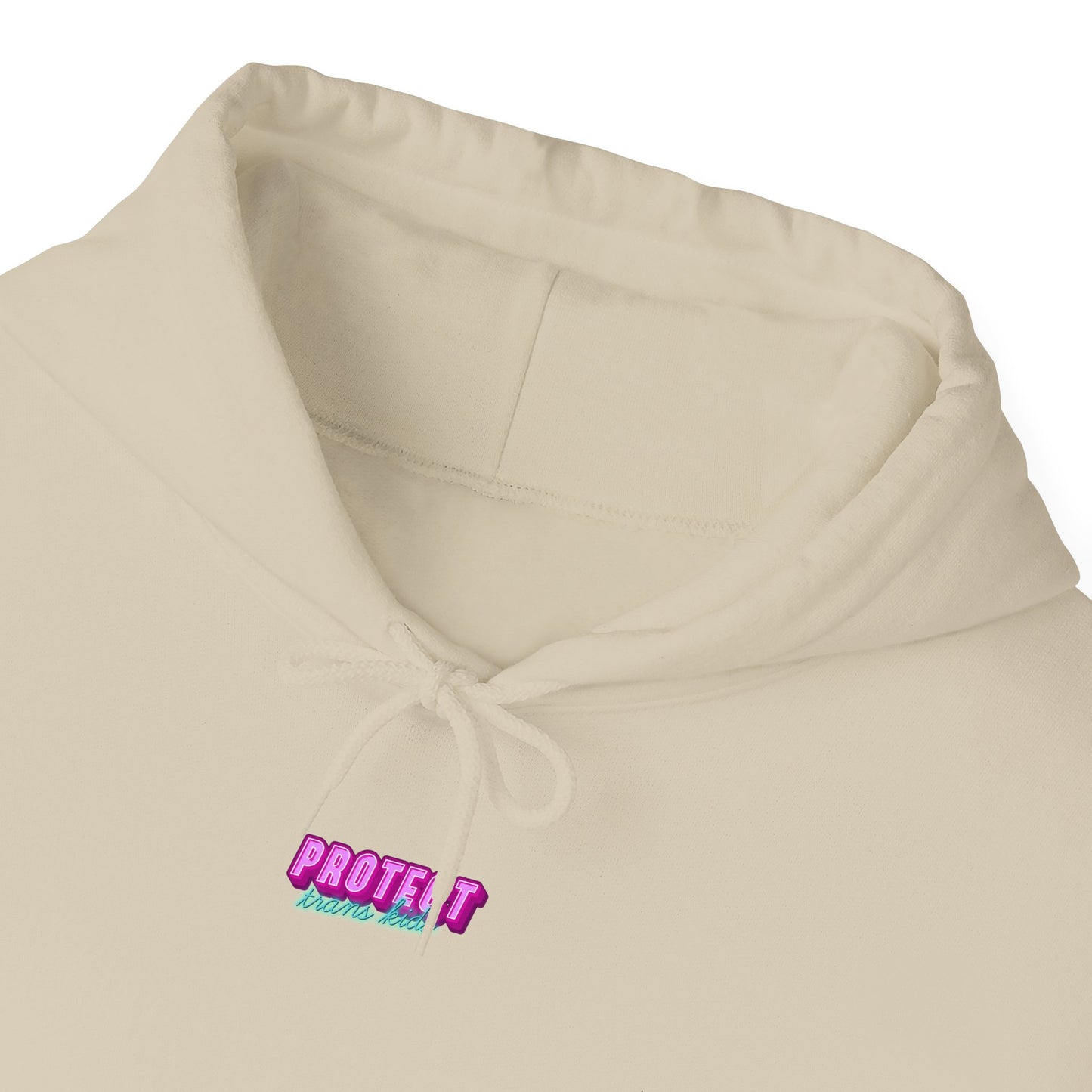 The Protect Trans Kids Hoodie, available in beige for unisex wear, features "PROTECT" embroidered in bold pink and "be kind to animals" in teal beneath. Crafted from ethically sourced cotton, it boasts a practical drawstring for style and comfort. Now available for shipping within Australia.