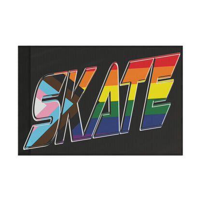 Introducing the SKATE progress pride original design flag - black by Printify. This rectangular flag features the word "SKATE" in bold and colorful letters that showcase various pride flag colors, including the rainbow Pride flag, the transgender flag, and the Progress Pride flag. Made from durable polyester organza with a satin finish, it’s perfect for displaying your queer skating pride.