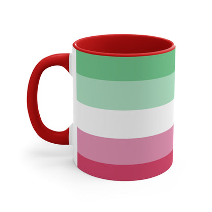 The Abro, Abroromantic, Abrosexual pride flag Accent Mug by Printify is a ceramic mug designed with horizontal stripes in green, light green, white, pink, and red to reflect the vibrant hues of the Abrosexual pride flag. It also features a pink handle and a colorful interior.