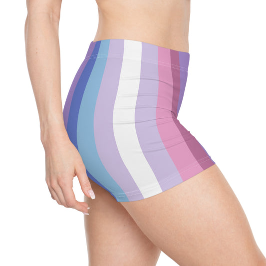 A person wearing the Bigender Pride Flag Short Shorts by Printify, featuring vertical stripes in shades of blue, purple, pink, and white, stands in a side view. The moisture-wicking fabric ensures comfort and style.