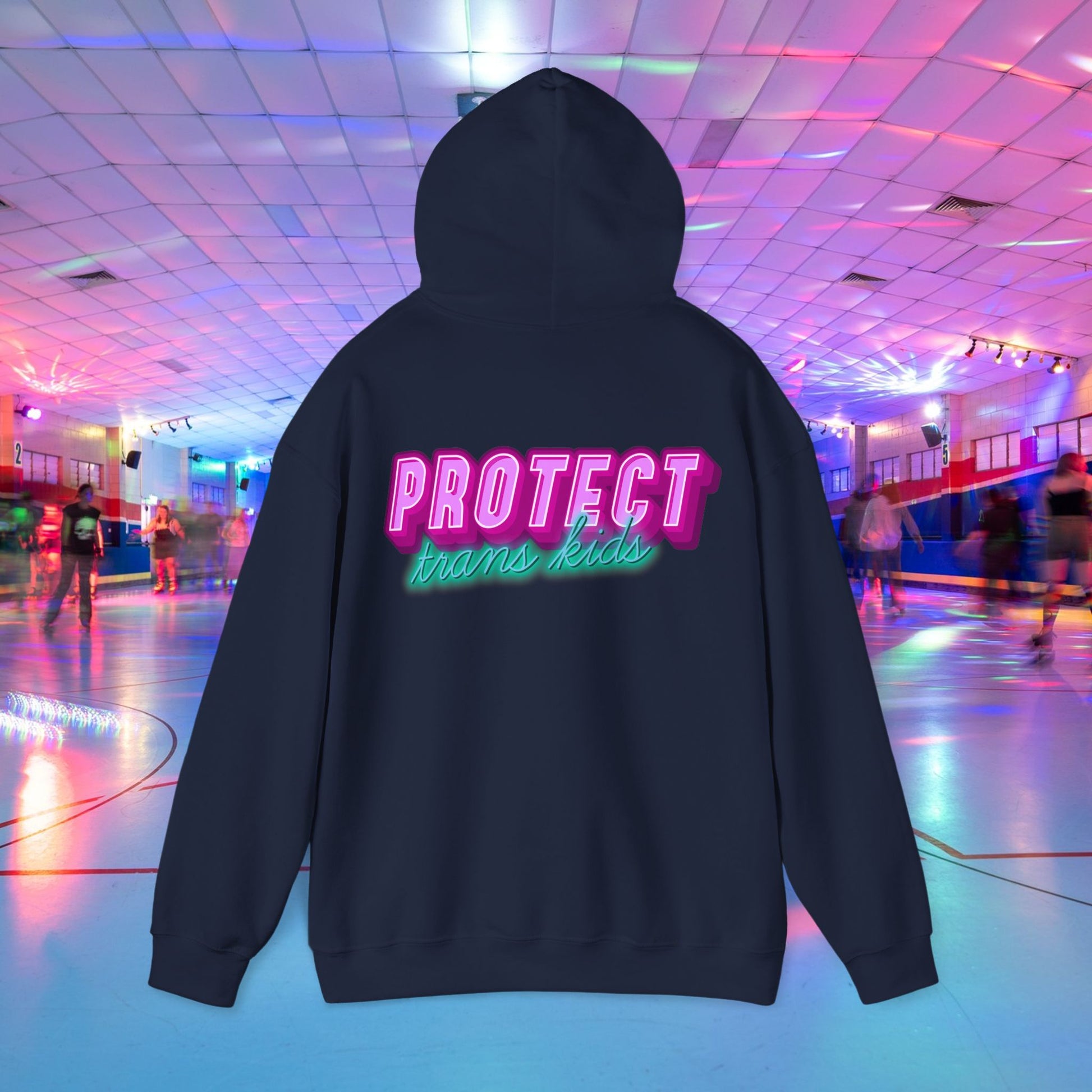 The Protect Trans Kids Hoodie is a cozy, unisex sweatshirt featuring "Protect trans kids" in vibrant pink and blue neon letters, set against a roller rink backdrop. Made from ethically sourced cotton, it combines striking design with comfort. Available for shipping in Australia.