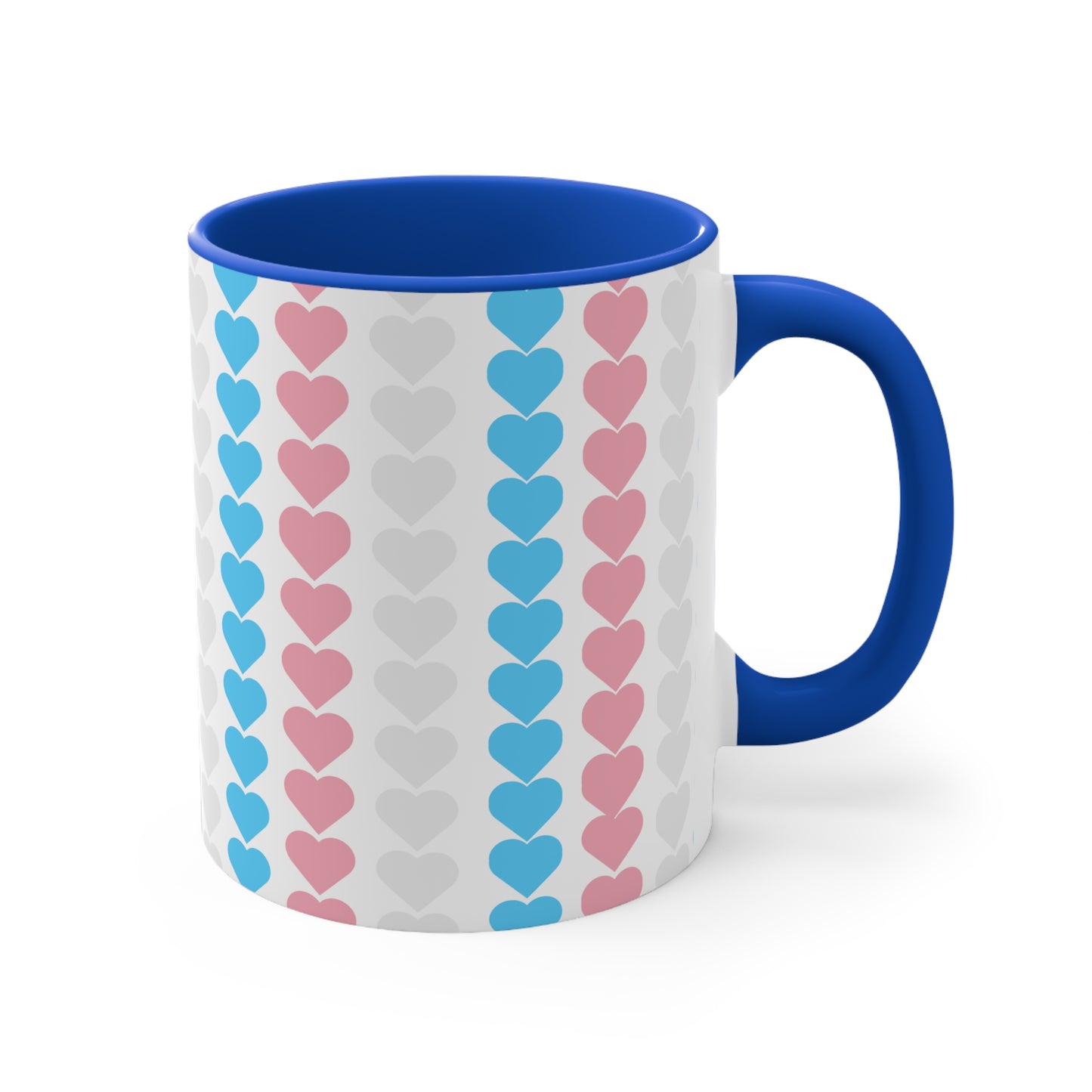 The Trans pride flag love hearts colourful accent mug by Printify features a white exterior adorned with vertical rows of pink, blue, and white hearts, reminiscent of the trans pride flag. Its cheerful and colorful appearance is enhanced by the pink handle and inner rim.