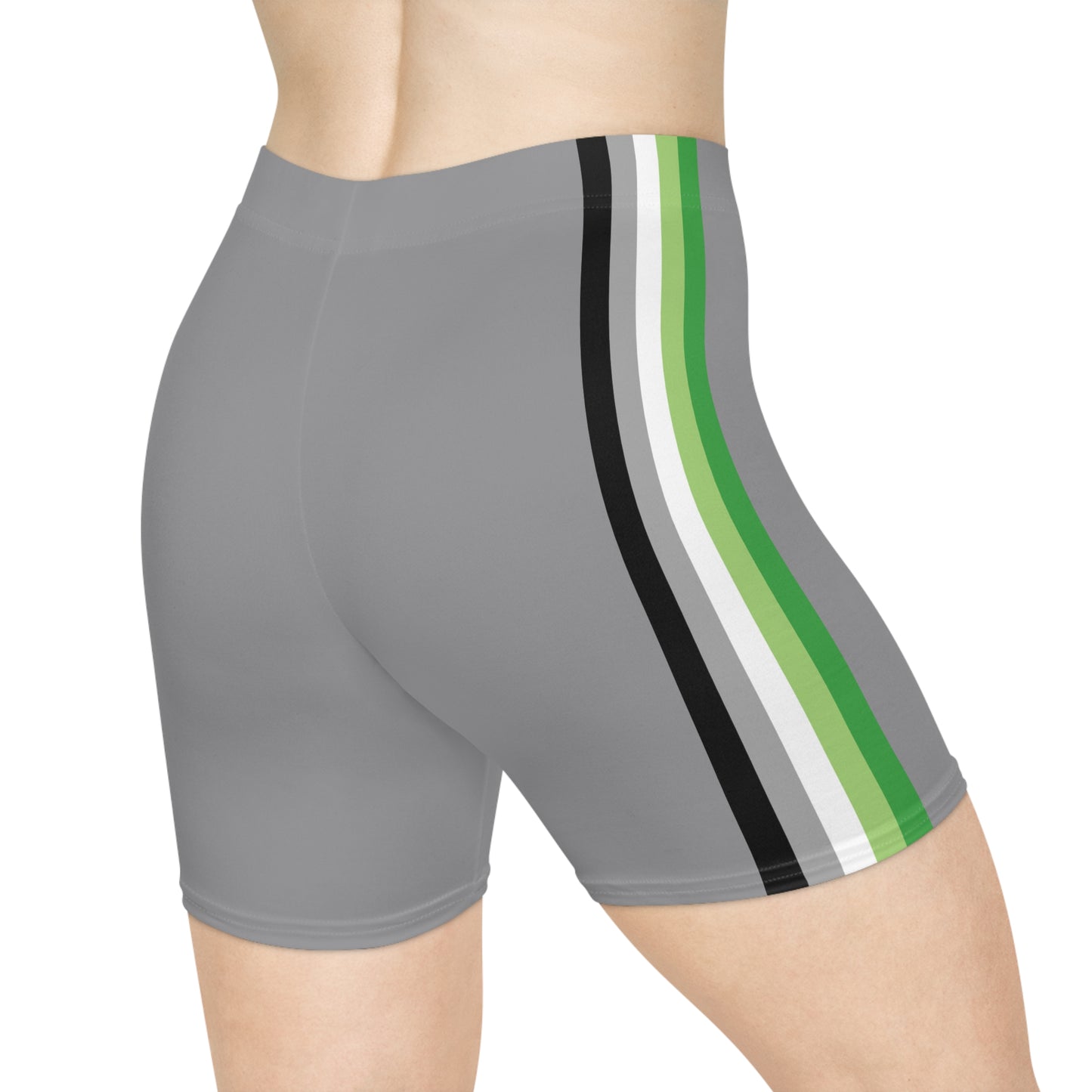 A person is wearing Aromantic Pride Flag Bike Shorts, featuring gray shorts with vertical stripes in black, white, dark green, and light green on the side. The photo focuses on their lower torso, buttocks, and upper portion of the legs, highlighting the moisture-wicking fabric of the shorts.