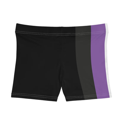 A person is modeling the Non-Binary Pride Flag Short Shorts by Printify, featuring high-waisted custom stripes in black, purple, white, and yellow. Made from moisture-wicking fabric that includes polyester and spandex, the shorts are displayed from the lower torso to the upper thigh.