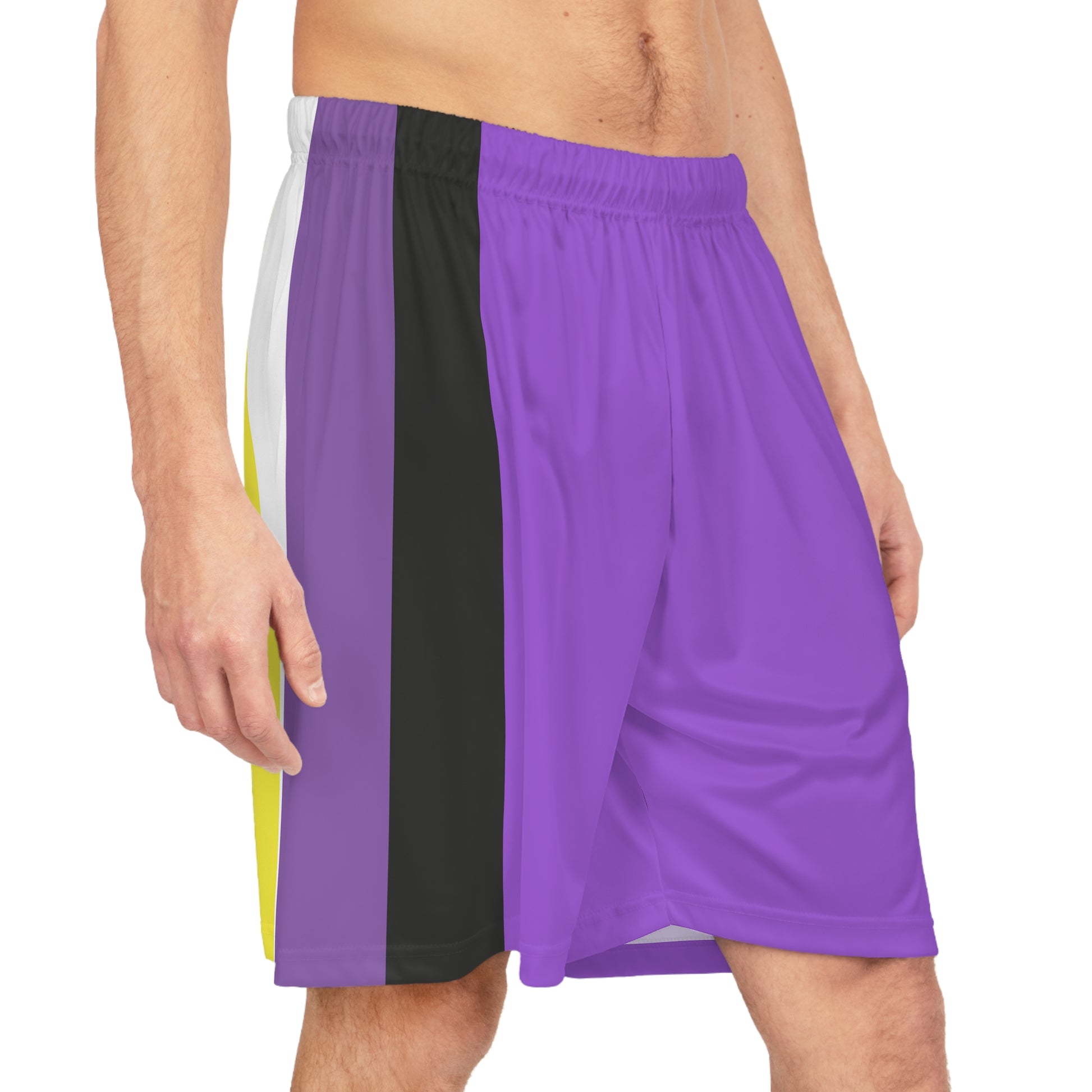 A person wearing Printify's Non-Binary Pride Flag Basketball Shorts in purple, which feature a multicolored side panel with vertical stripes of white, yellow, black, and purple, along with an adjustable waistband.