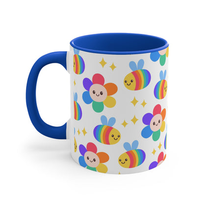 The Subtle Rainbow Pride - Flowers and Bees Colourful Accent Mug by Printify is a white ceramic mug with a red handle and colored interior, adorned with a vibrant pattern of adorable smiling bees and flower designs. The cheerful bees and flowers are rendered in bright rainbow colors reminiscent of the pride flag, with small yellow stars scattered throughout.