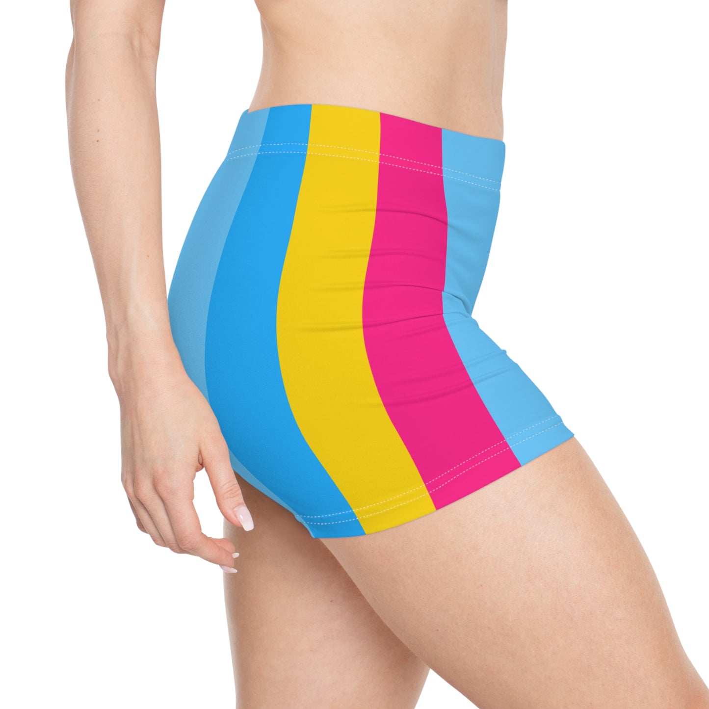 A person is wearing Pansexual Pride Flag Short Shorts from Printify. These custom high-waisted athletic shorts feature vertical color stripes in blue, yellow, and pink. Made from a polyester spandex blend, they ensure a comfortable fit. The background is white, with the person's upper torso and lower thighs visible.