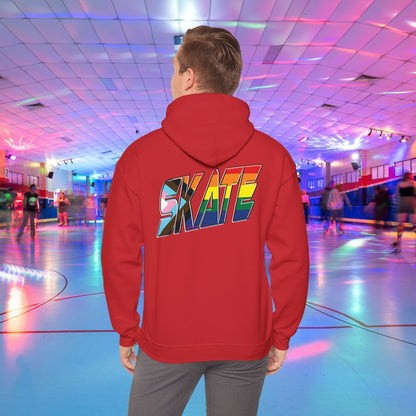 A person with short hair is wearing a GAYSKATE SKATE Progress Pride Hoodie, showcasing a rainbow pride flag gradient "SKATE" design on the back. They are facing away from the camera in a roller skating rink illuminated by vibrant, colorful lights and surrounded by other skaters.