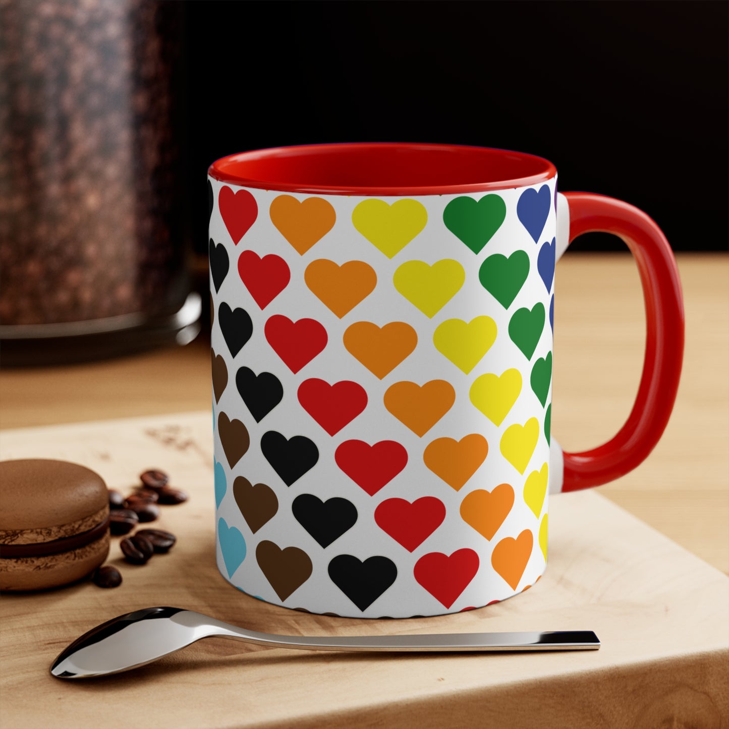 Introducing the Progress Pride Flag Love Hearts - Colourful Accent Mug by Printify: a ceramic mug featuring a vibrant red handle and a lively interior, adorned with diagonally arranged rows of hearts in shades of purple, blue, pink, green, and yellow. The hearts are evenly spaced across the surface, creating a charming and festive design.