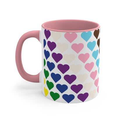 Introducing the Progress Pride Flag Love Hearts - Colourful Accent Mug by Printify: a ceramic mug featuring a vibrant red handle and a lively interior, adorned with diagonally arranged rows of hearts in shades of purple, blue, pink, green, and yellow. The hearts are evenly spaced across the surface, creating a charming and festive design.