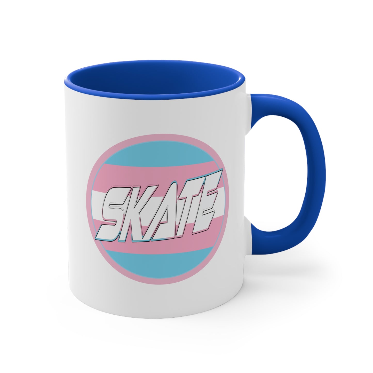 The SKATE trans flag circle design accent mug by Printify features a white exterior, blue handle, and blue interior. It showcases a circular design inspired by the trans flag, incorporating pink, light blue, and white colors. The word "SKATE" is prominently displayed in dynamic white letters at the center of the design.