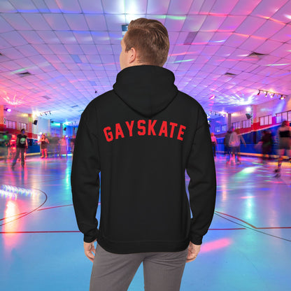 A person wearing a Printify Gay Skate 1982 Retro Hoodie, a high-quality unisex heavy blend hooded sweatshirt, with the word "GAYSKATE" in bold red letters on the back stands in a brightly lit roller skating rink. The rink features colorful lights and skaters in motion, creating a lively atmosphere.