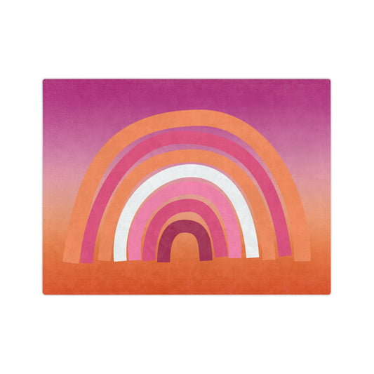 The Printify Minky Blanket Lesbian Rainbow Pride Flag is a velveteen microfiber blanket showcasing vibrant curved bands in purple, pink, orange, and white on a gradient background that shifts from pink to orange.