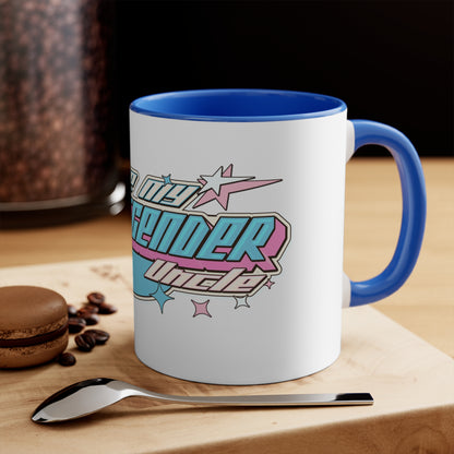 The "I Love My Transgender Uncle" original design accent mug by Printify is a white ceramic mug with a blue interior, showcasing an eye-catching design in cyan, pink, and white retro-style text that reads "Love My Transgender Uncle." It features star-shaped accents and a background with complementary colors.