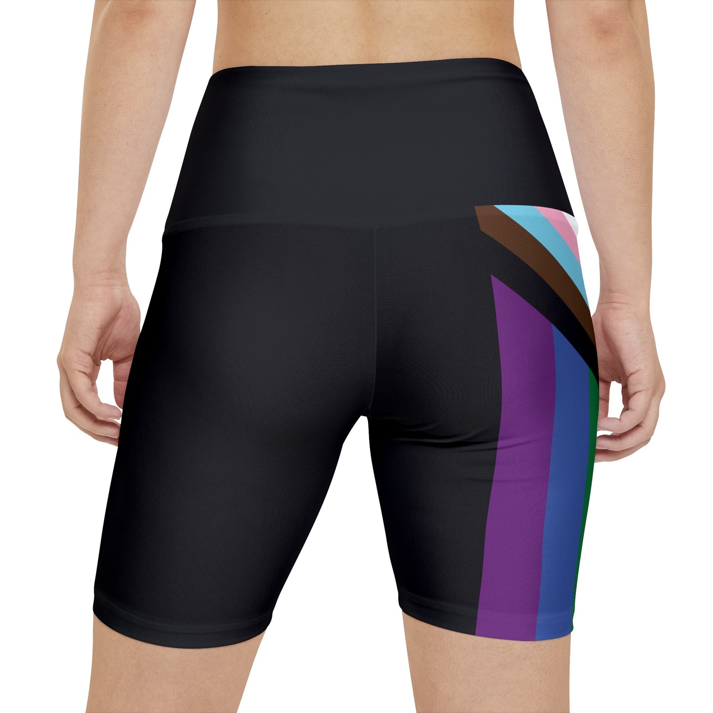 A person wearing Printify's Progress Pride Rainbow Flag High-Waisted Workout Pants, featuring a vibrant design perfect for an active lifestyle. The shorts display horizontal stripes in black, brown, light blue, pink, white, red, orange, yellow, green, and blue against a white background.