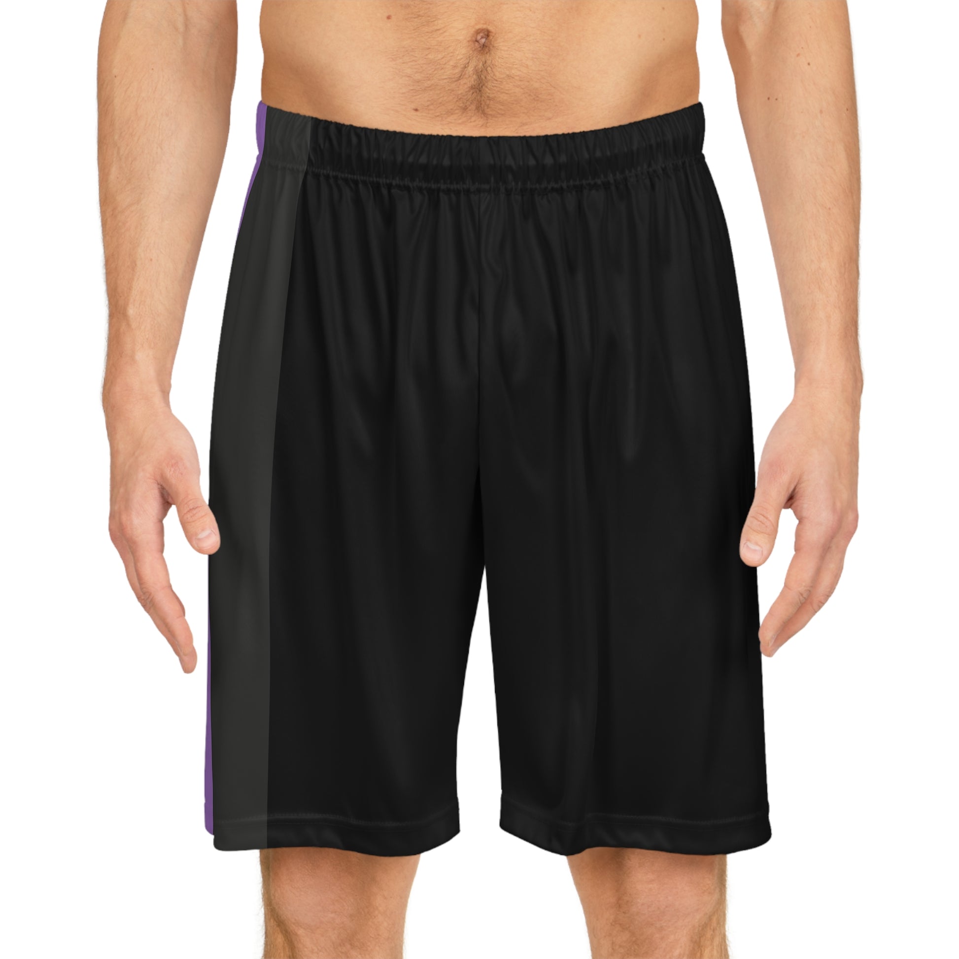 A person is standing wearing Non-Binary Pride Flag Basketball Shorts - Black from Printify, featuring an elastic waistband and side panels in vertical stripes of white, yellow, purple - thr nonbinary pride flag. The individual is shirtless, showing their midsection and a portion of their legs.