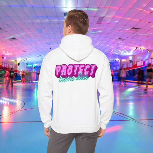 A person is at a roller skating rink, sporting a high-quality Protect Trans Kids Hoodie from Printify, crafted from ethically grown cotton, with "PROTECT trans kids" boldly and colorfully emblazoned on the back. The rink is bathed in vibrant, colorful lights, and other skaters can be seen gliding in the background.