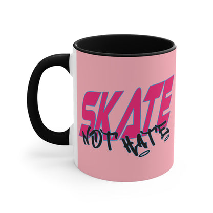 The Skate Not Hate accent mug by Printify is a white ceramic coffee mug featuring an eye-catching pink background and black handle. The design includes bold pink and blue text that reads "SKATE" paired with black graffiti-style text below it that reads "NOT HATE." This stylish mug makes a powerful statement against hate.