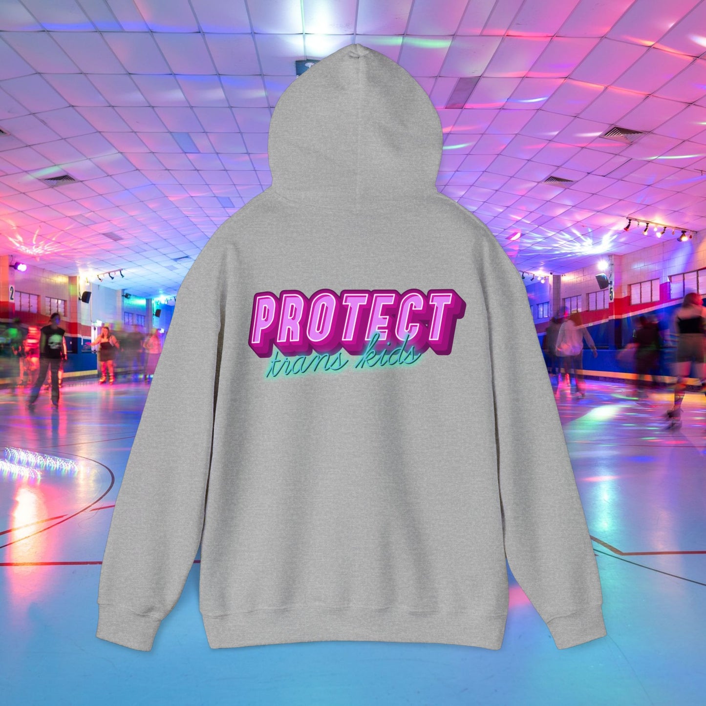 The "Protect Trans Kids Hoodie" features bold pink and blue lettering on ethically grown cotton. Set against a neon roller skating rink, this unisex heavy blend sweatshirt offers comfort and style for all wearers. Now available with Australian shipping.