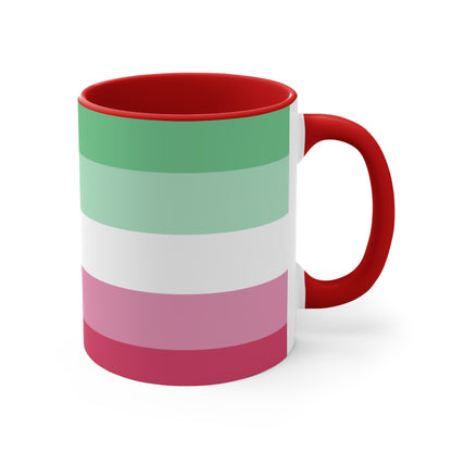 The Abro, Abroromantic, Abrosexual pride flag Accent Mug by Printify is a ceramic mug designed with horizontal stripes in green, light green, white, pink, and red to reflect the vibrant hues of the Abrosexual pride flag. It also features a pink handle and a colorful interior.