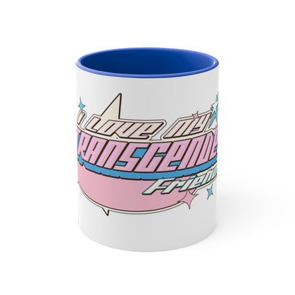 The "I Love My Transgender Friends original design accent mug" by Printify is a white ceramic mug with a black interior, showcasing an eye-catching exterior. Adorned with playful text in pastel pink, blue, and cream that reads "I love my transgender friends," the design is accented by small stars.