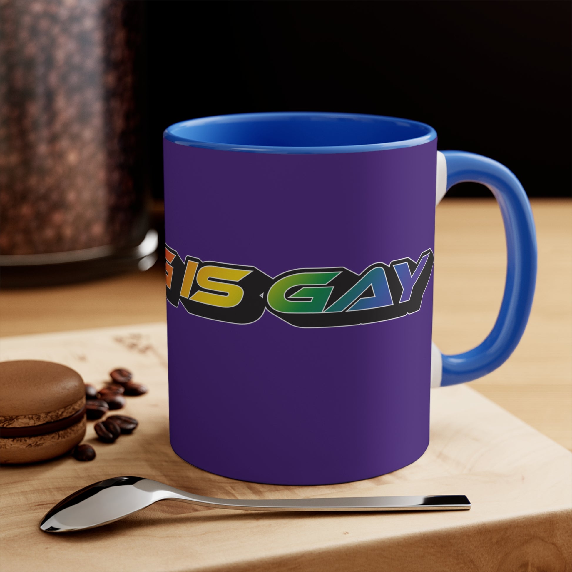 Displayed is the SKATING IS GAY rainbow gradient accent mug by Printify. This eye-catching mug features a purple exterior and a colorful interior, with the text "SKATING IS GAY" displayed in gradient colors of red, orange, yellow, and green. The dynamic design is enhanced by its shadowed font style.