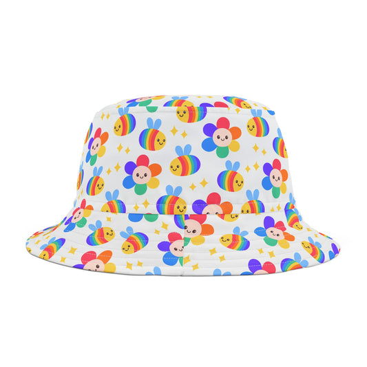 The Rainbow Bees and Flowers Bucket Hat - Subtle Pride Wear by Printify is a vibrant polyester accessory featuring a pattern of smiling bee-like characters in rainbow colors and flowers on a white background. Scattered golden star accents enhance the design. Available in two sizes, this hat boasts a wide brim and cylindrical crown.