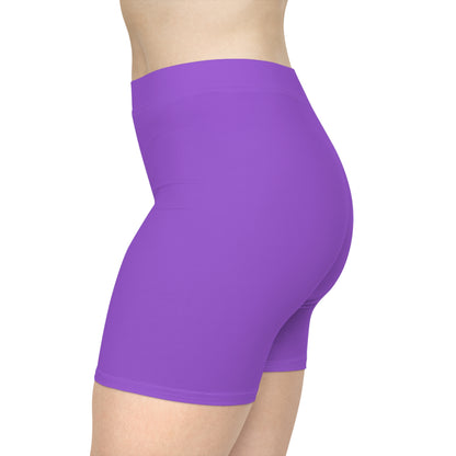 A person is wearing Non-binary Pride Flag Bike pants, featuring moisture-wicking polyester material and vertical stripes in black, purple, white, and yellow on the side - the nonbinary pride flag. The image shows the lower torso and upper thigh area from a side view.