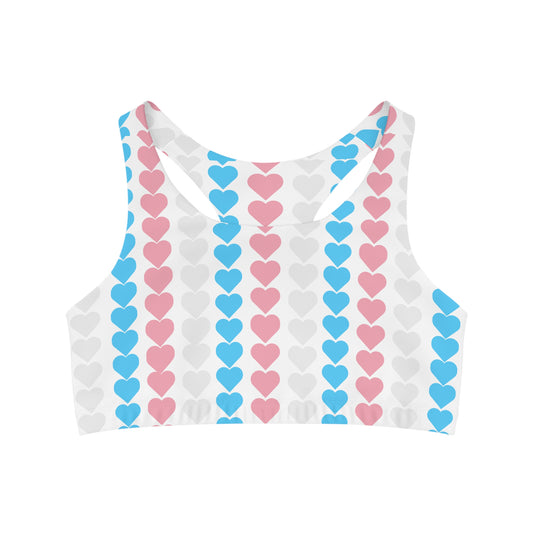 Experience comfort and style with Printify's Trans Pride Love Heart Seamless Sports Crop. This LGBTIQAP+ active wear features a charming pattern of vertical rows of hearts in pink, blue, and white on a pristine backdrop inspired by the trans pride flag. Designed with a racerback and moisture-wicking fabric, it's perfect for active days.