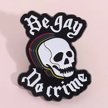 Skull design with 'Be Gay, Do Crime' enamel pin