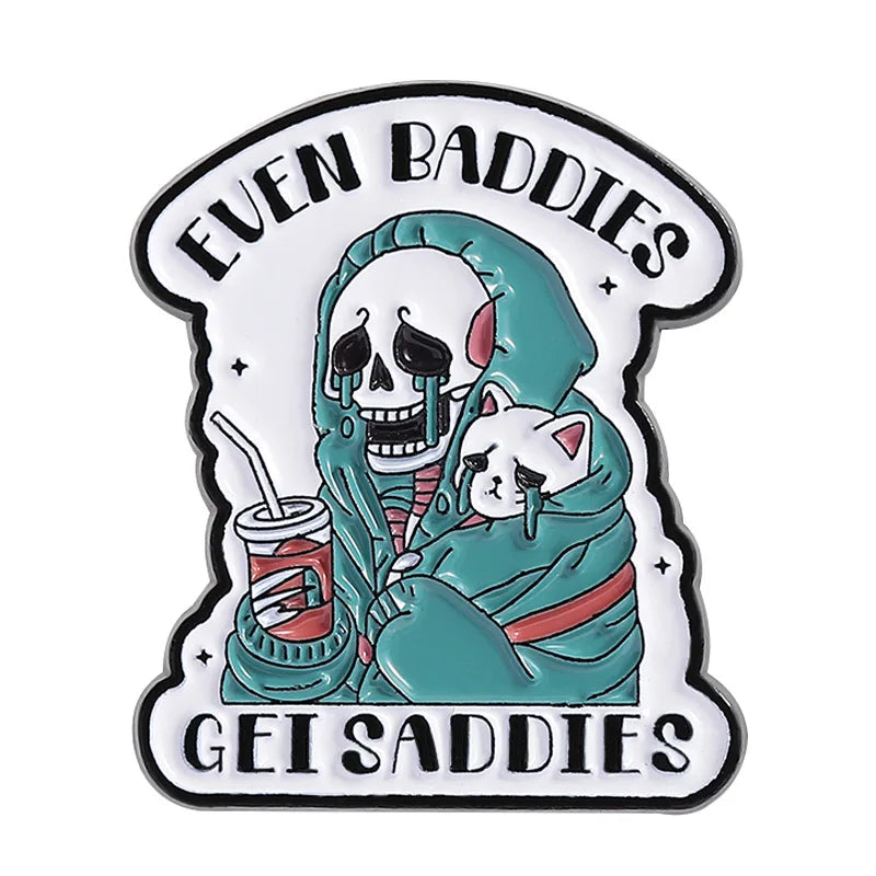 Cartoon skeleton holding a cat with text 'Even Baddies Get Saddies' enamel badge