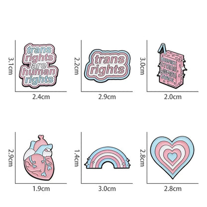 Product Description: The "Trans Rights and Trans Pride" enamel pins collection by Gay Skate includes six beautifully designed badges celebrating transgender pride. Top row designs feature: "Trans Rights Are Human Rights," "Trans Rights," and "Respect Trans Women Juice." Bottom row designs include an anatomical heart with trans flag colors, a heart with layered trans flag colors, and a rainbow with trans flag colors.