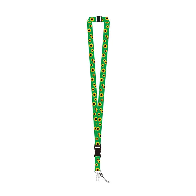 A green lanyard strap with a repeating Invisible Disability sunflower print, featuring black plastic buckles and a silver metal carabiner clip at the bottom