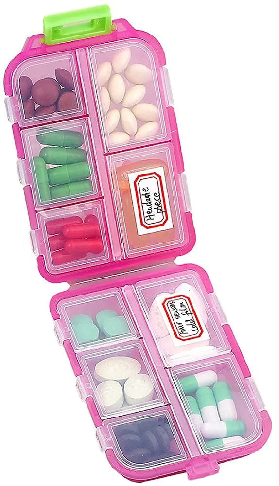 Pink medication organiser with compartments labeled 