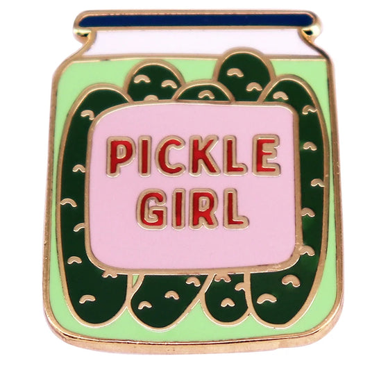 Spiro making you thirsty? Grab this salty treat as a cute gift for tgirls, transgirls, transwomen and transfemmes who are using HRT.
The Pickle Girl Jar Enamel Pin by Gay Skate features a vibrant pickle jar design, showcasing green pickles inside. The jar has a central label with "PICKLE GIRL" in bold red letters on a pink background. It is outlined in gold and includes a blue bar at the top to represent the jar lid—ideal for transfemmes looking to express their unique style.