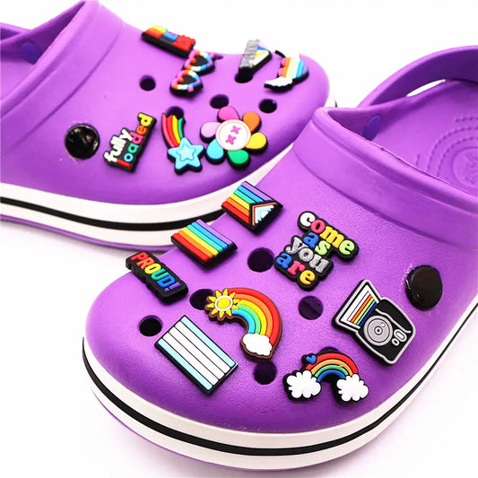 Trans pride and Rainbow pride Crocs Jibbitz with motifs like rainbows, pride flags and messages such as "come as you are" and "proud!" Jibbitz to celebrate the LGBTQ+ community 