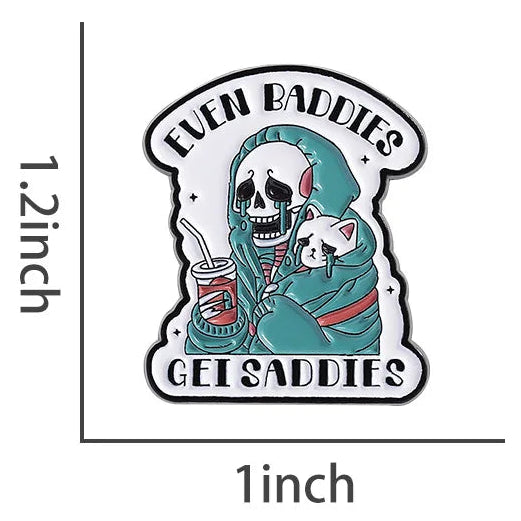 Badge with a skeleton holding a cat and text 'Even Baddies Get Saddies' background.