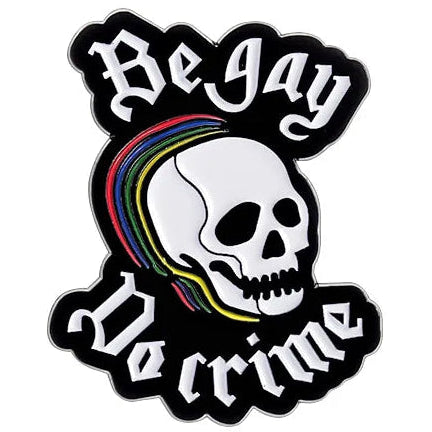 Enamel pin with skull design, rainbow flag, and text 'Be Gay Do Crime'
