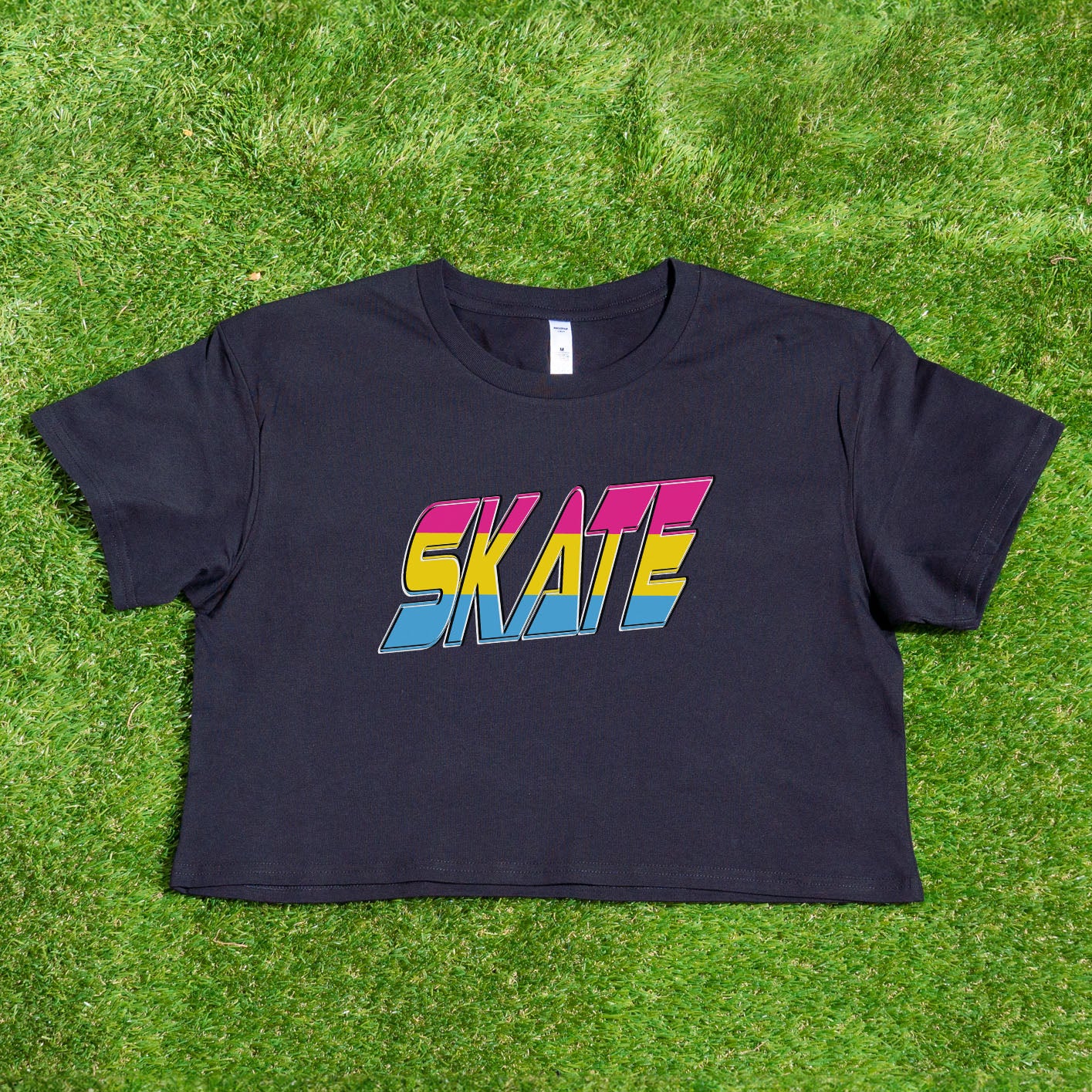 The TRANS RIGHTS original design - locally printed crop tee by Gay Skate is a black cropped T-shirt featuring a vibrant graphic in the center with bold, stylized text reading "TRANS RIGHTS." The design incorporates pastel shades and a lightning bolt motif above the text, celebrating transgender pride.