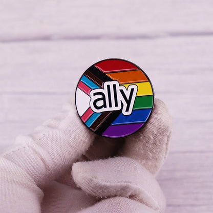 Ally enamel pin featuring progress pride flag