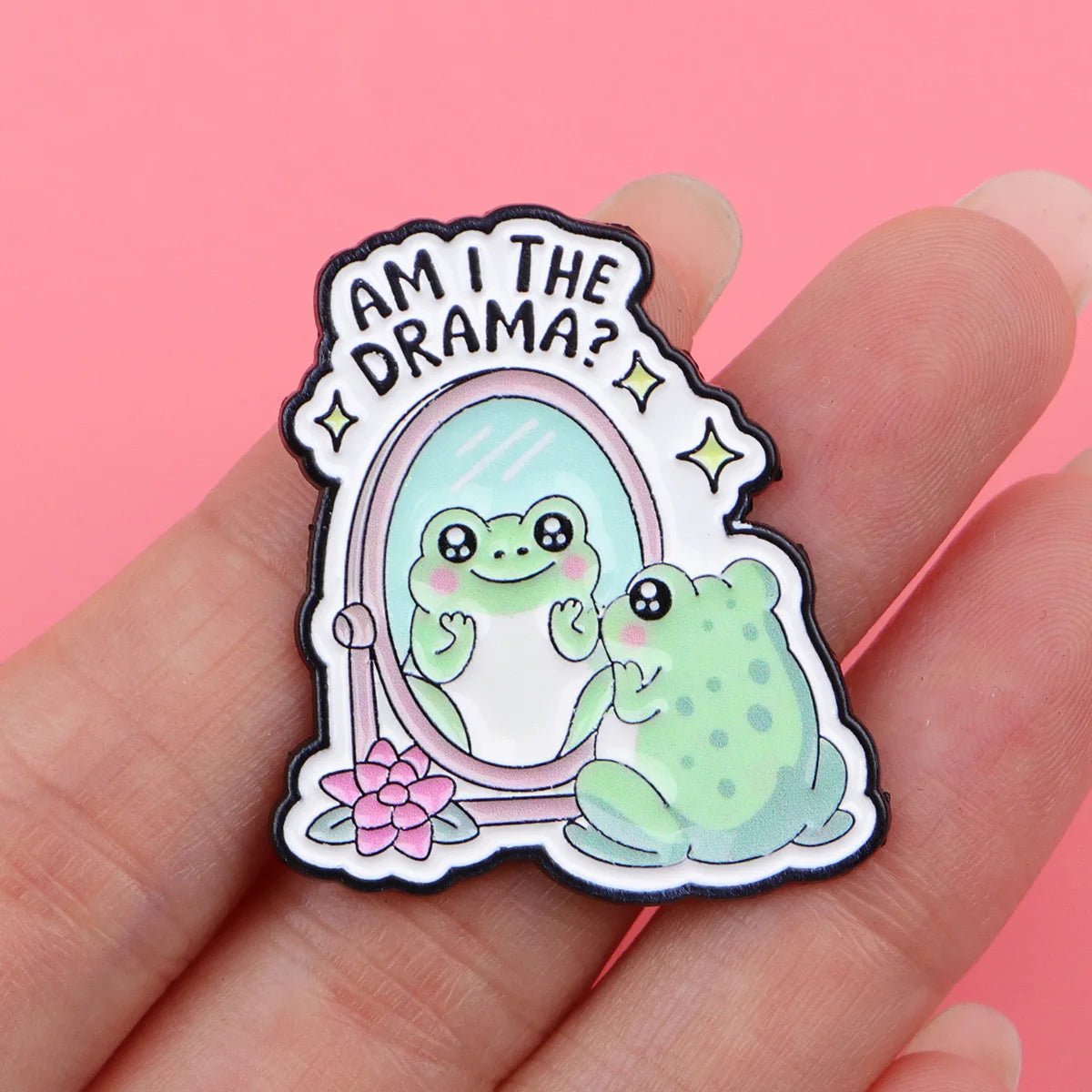 Badge with a cute cartoon frog looking into a mirror with 'Am I the drama?' text. Drag queen meme