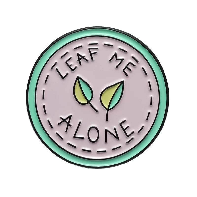 Circular badge with 'Leaf Me Alone' text and leaf illustrations 