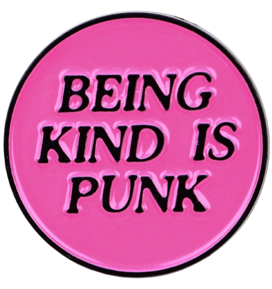 Pink button with black text 'BEING KIND IS PUNK' 