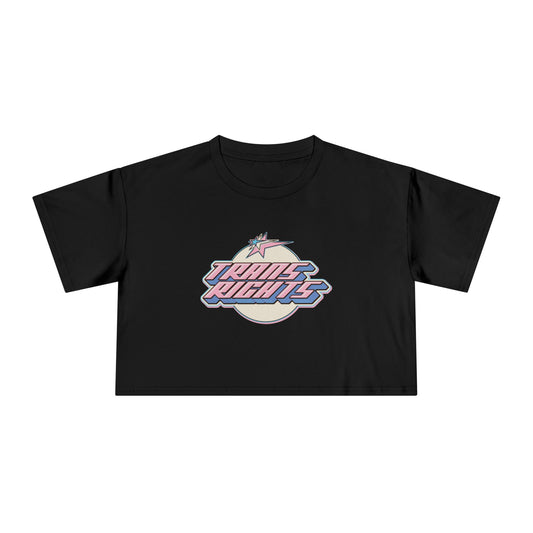 The TRANS RIGHTS original design - locally printed crop tee by Gay Skate is a black cropped T-shirt featuring a vibrant graphic in the center with bold, stylized text reading "TRANS RIGHTS." The design incorporates pastel shades and a lightning bolt motif above the text, celebrating transgender pride.