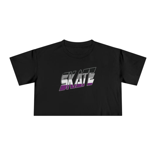 A black cropped T-shirt with "SKATE" emblazoned across the chest in a bold, futuristic font featuring an eye-catching gradient effect transitioning from white to purple. This piece of queer skatewear by Gay Skate, named the SKATE asexual pride flag - locally printed crop tee, features short sleeves and a round neckline, embodying both style and pride.