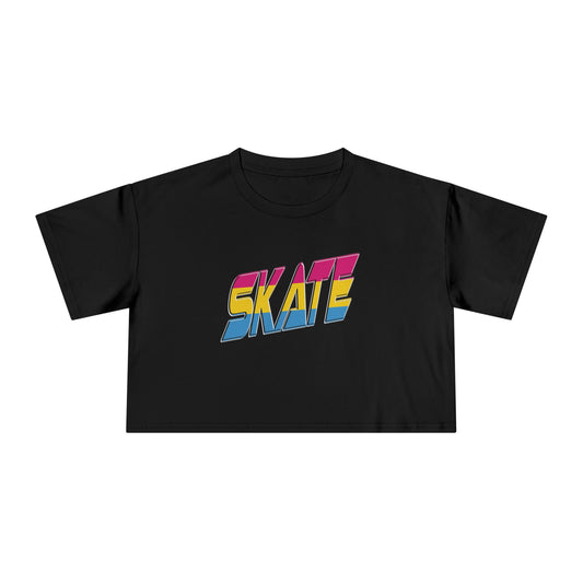 A black, short-sleeved crop top from the Gay Skate brand features the word "SKATE" written in bold, colorful letters on the front. The letters are filled with a vibrant gradient of pink, yellow, and blue shades, celebrating a retro feel while embracing elements of the pansexual Pride flag for an inclusive touch to this stylish piece. This locally printed tee is named "SKATE pansexual pride flag.