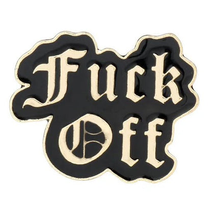 Enamel pin with gold 'Fuck Off' text on a black background