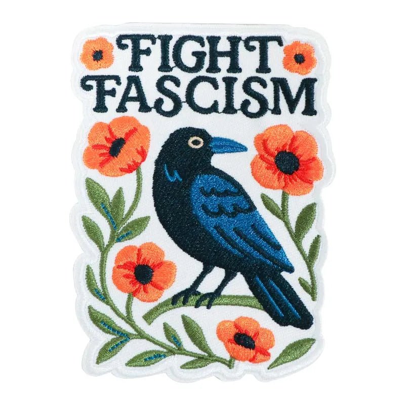 Embroidered patch with a crow, flowers, and 'Fight Fascism' text 